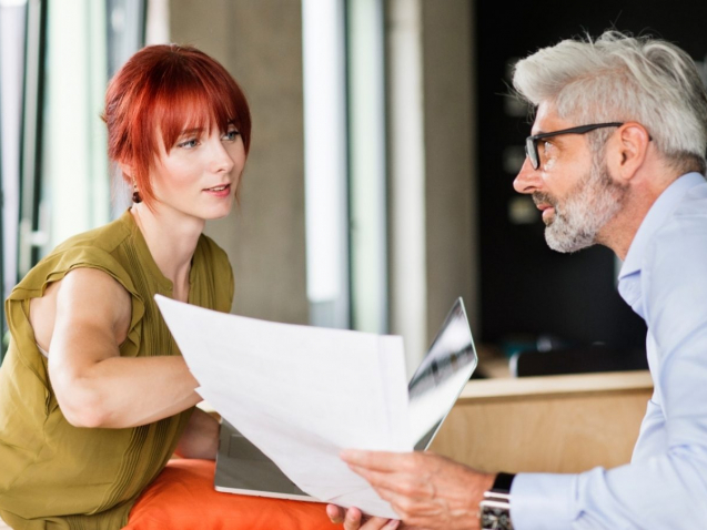 business-people-in-creative-office-consulting-a-P48WVT9-1600x900